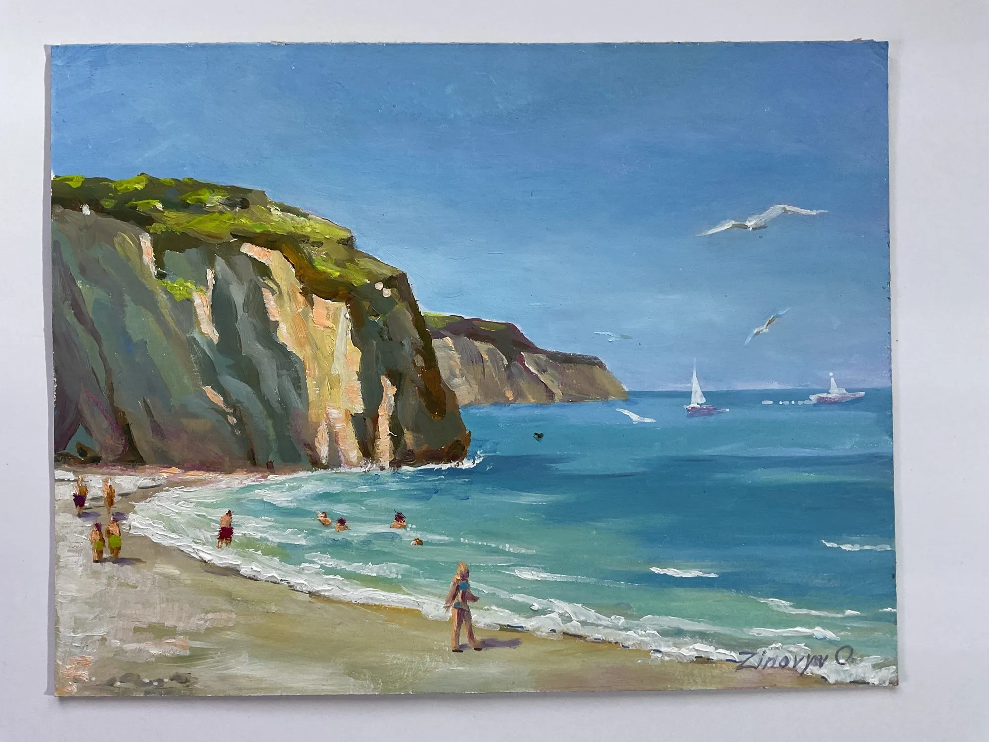 Painting “Studies on the Pacific” by Oleksandr Zinovyev: A bay with green cliffs, bathers on the beach and white sailboats on the water.