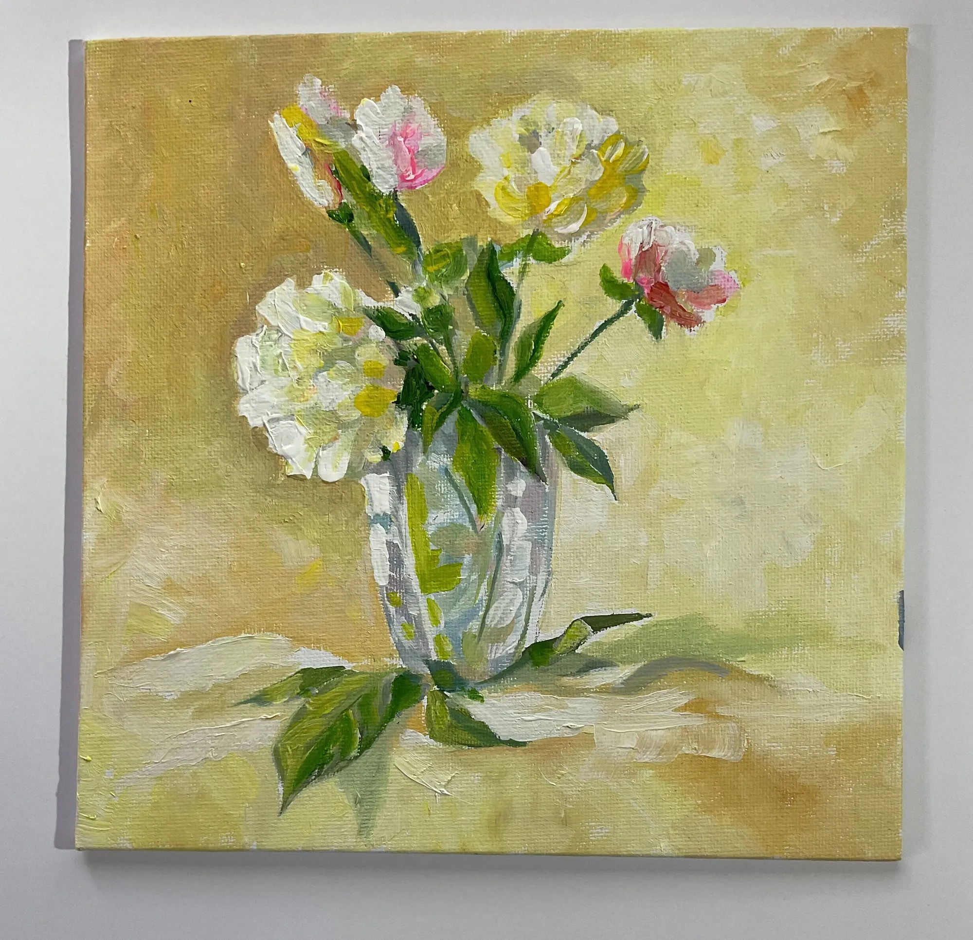 Painting “Yellow Still Life” by Oleksandr Zinovyev: Pink and white peonies in a glass vase on a yellow ground.