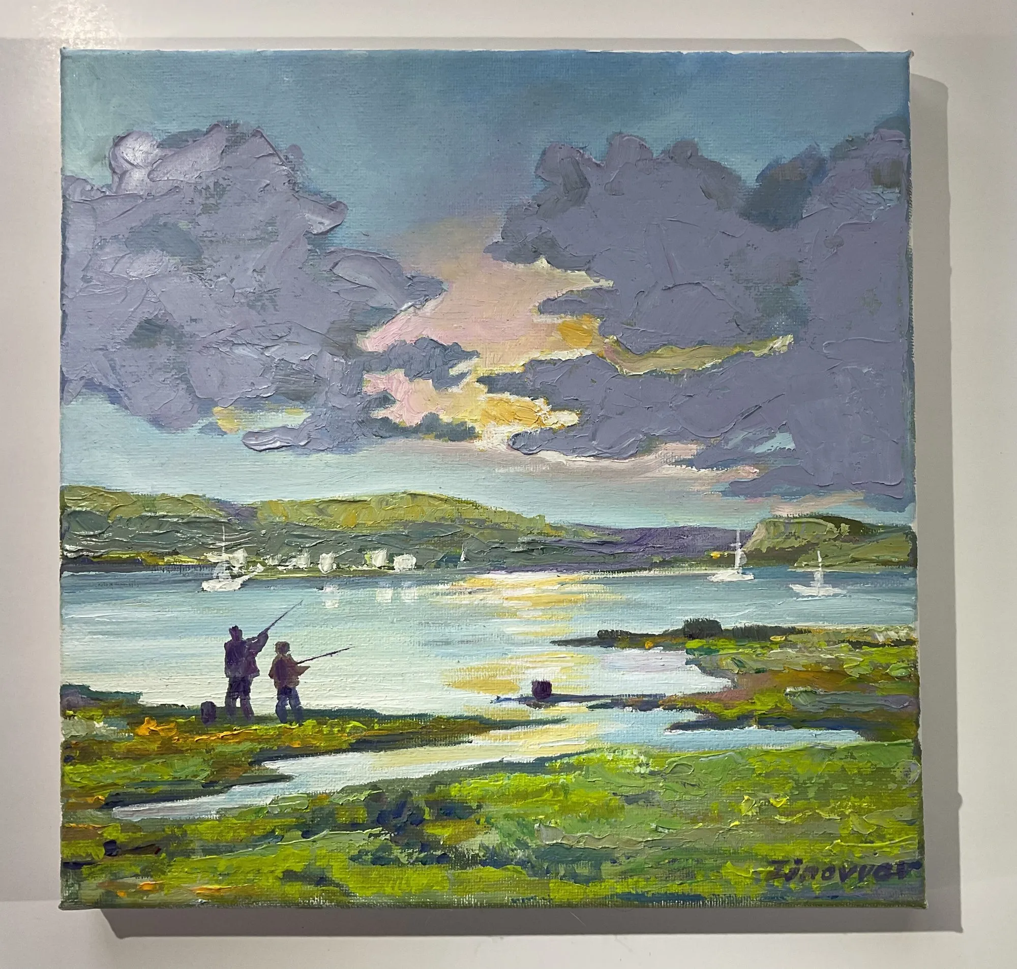 Painting “Fishermen” by Oleksandr Zinovyev: Two fishermen on a grassy bank at sunset over a river with boats, under lilac clouds.
